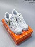 Pair of white low-top sneakers with dark side Swooshes, red accents, and an orange shoe box