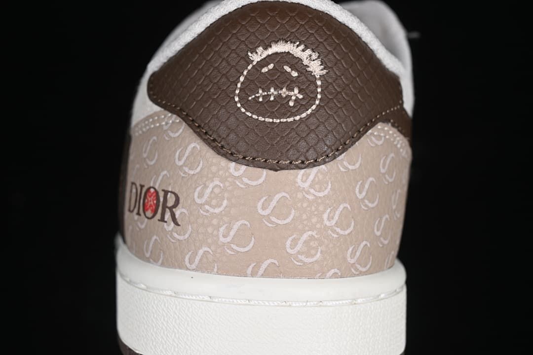 Rear close-up showing patterned beige heel panels and dark brown heel tabs.
