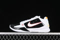 Side view of white and black Nike Kobe 5 Protro shoes with red and yellow accents