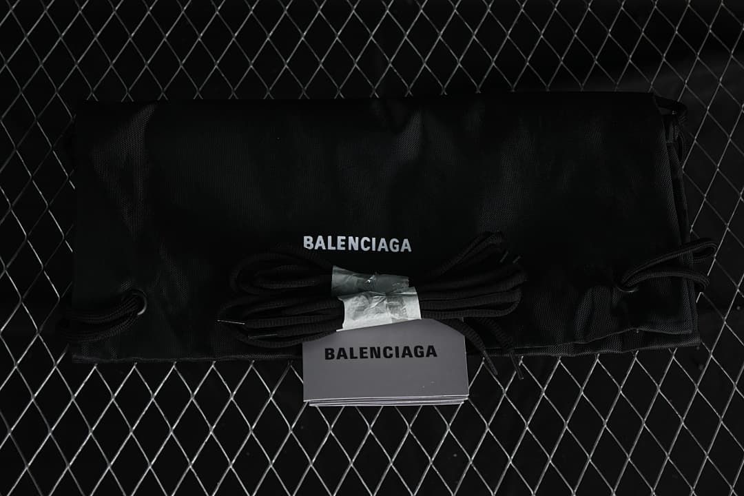 Black branded drawstring shoe bag, spare laces and booklet shown as accessories.