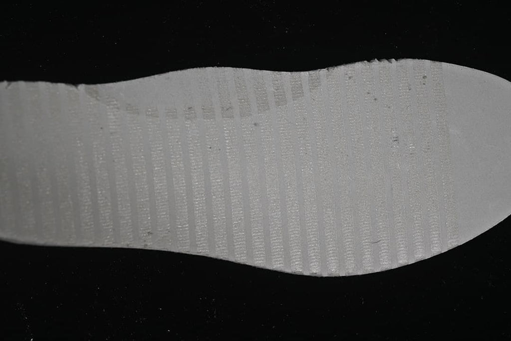 Close-up of the pale textured outsole