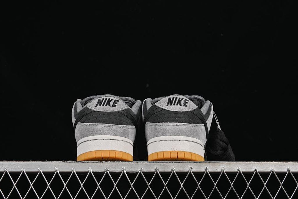 Rear view of both shoes showing heel panels and gum outsoles