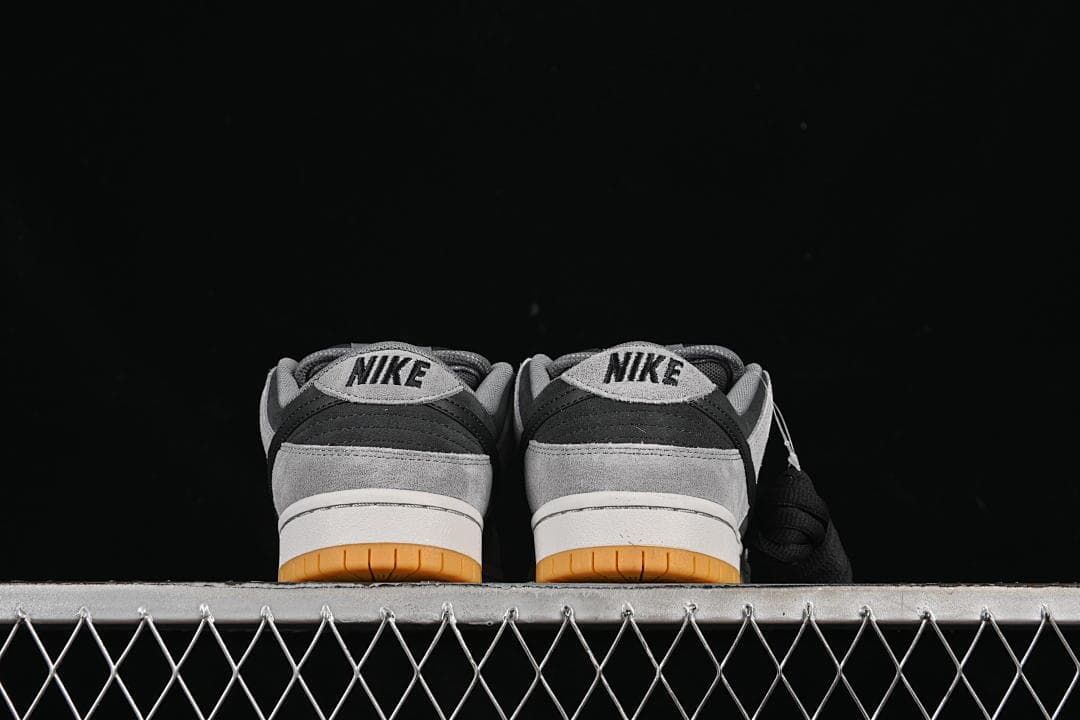 Rear view of both shoes showing heel panels and gum outsoles