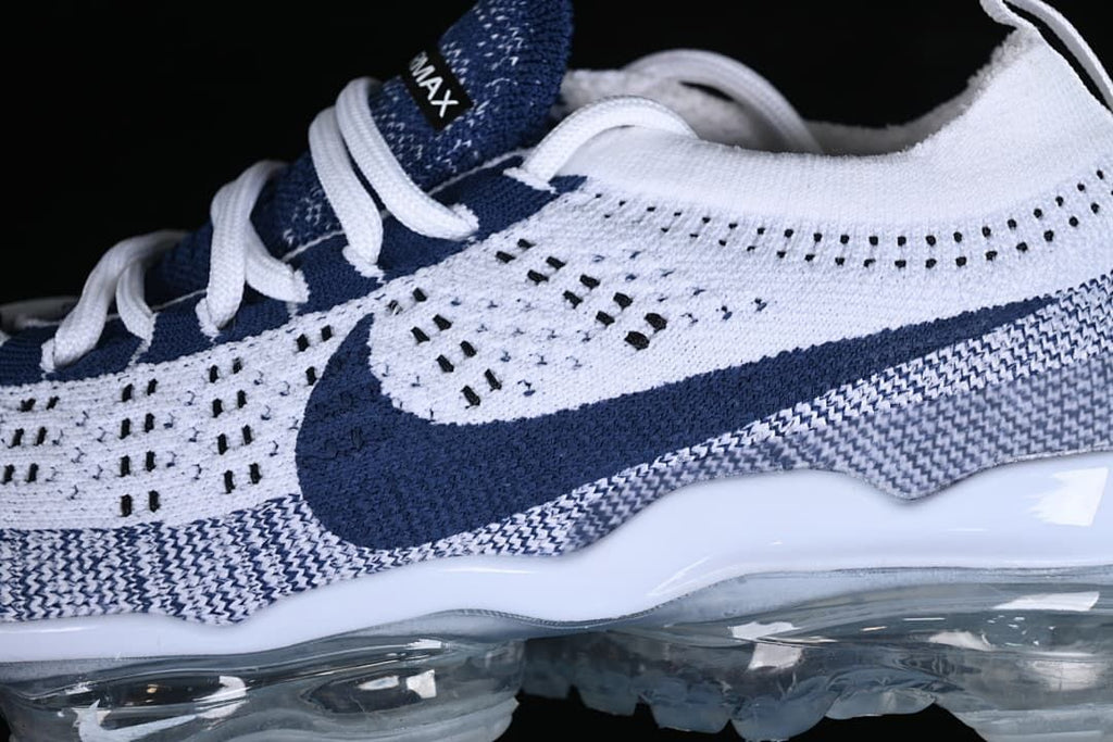 Close-up of the knit upper, navy Swoosh and transparent Air sole