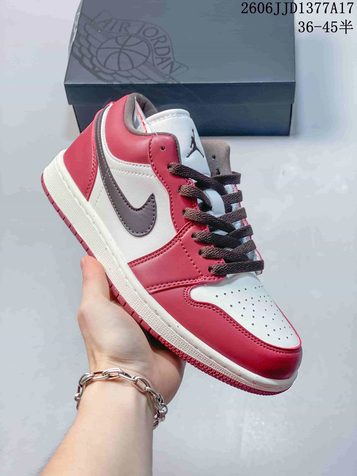 Angled side view of the burgundy, white, and brown sneaker