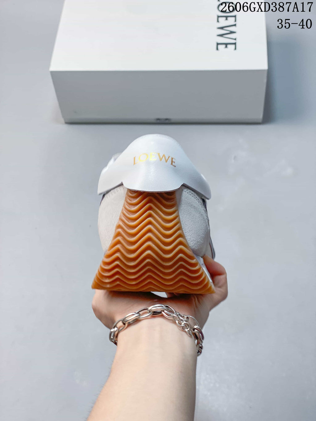 Rear view of the sneaker showing the gum outsole and heel