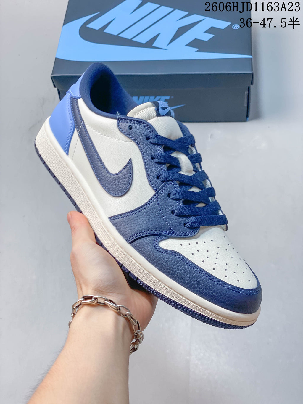 Angled side view of the blue and white low-top sneaker