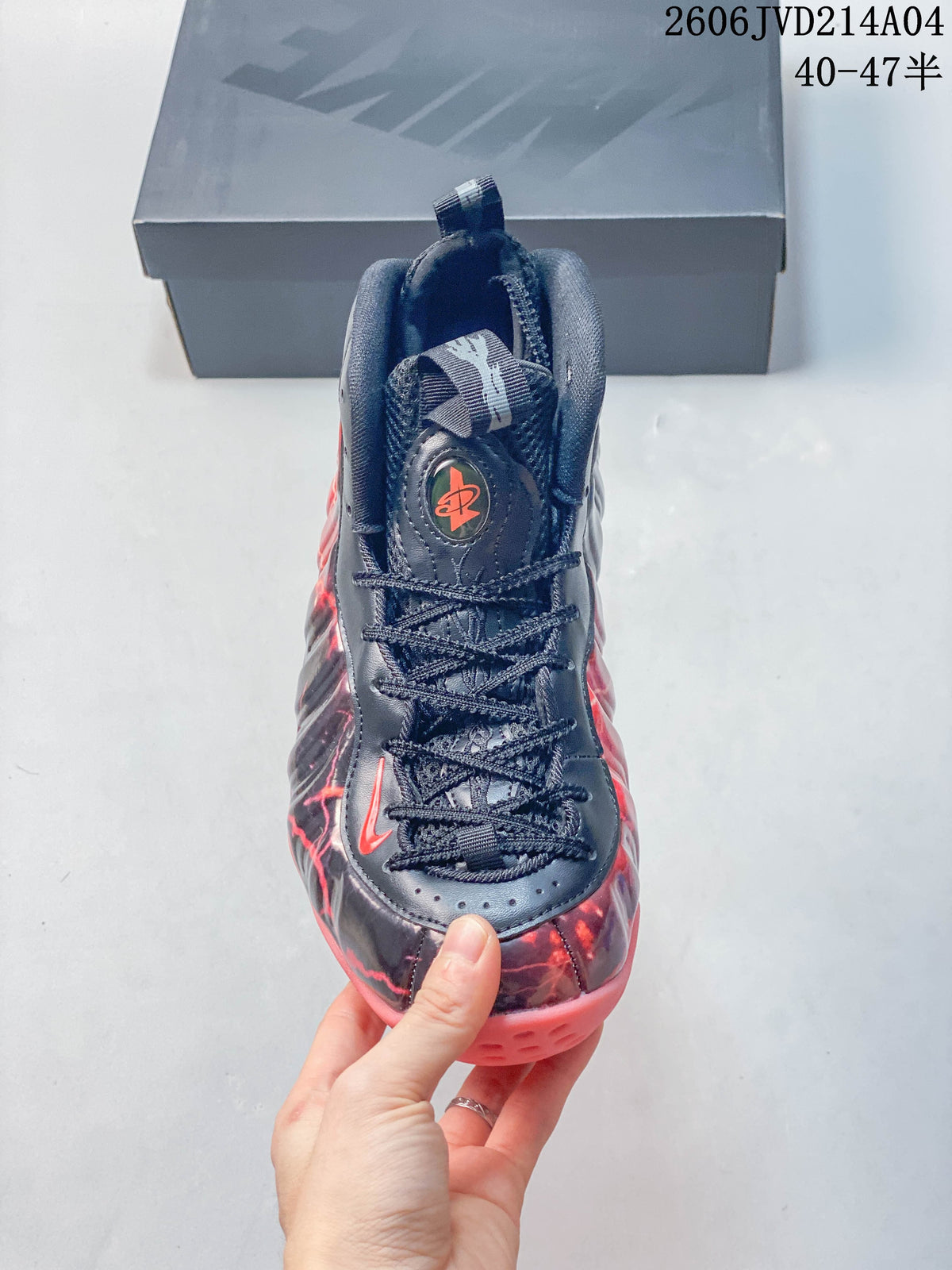 Front view showing the laces, padded tongue and red graphic details.