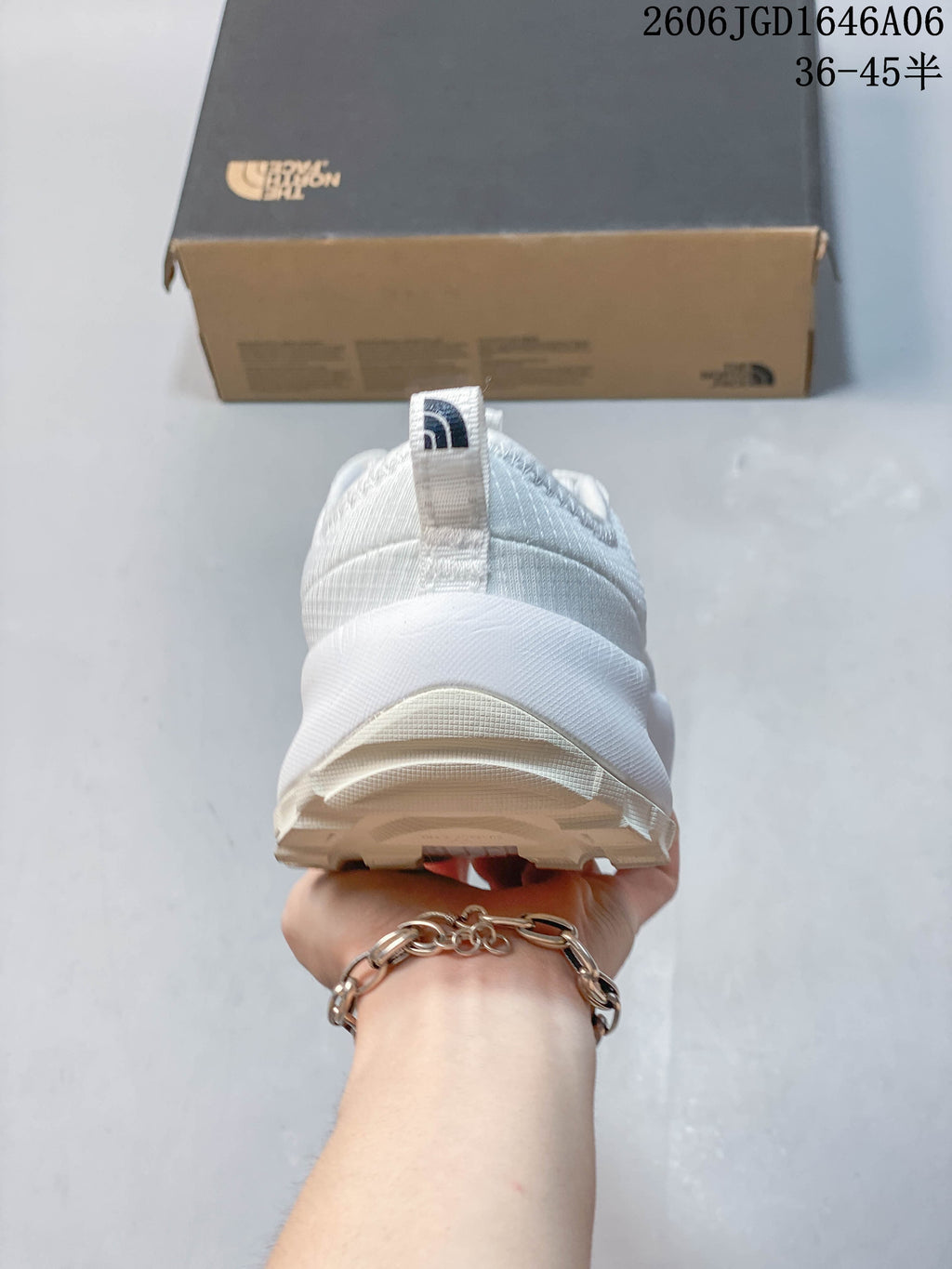 Rear view of the white mule shoe showing the heel pull tab and outsole.