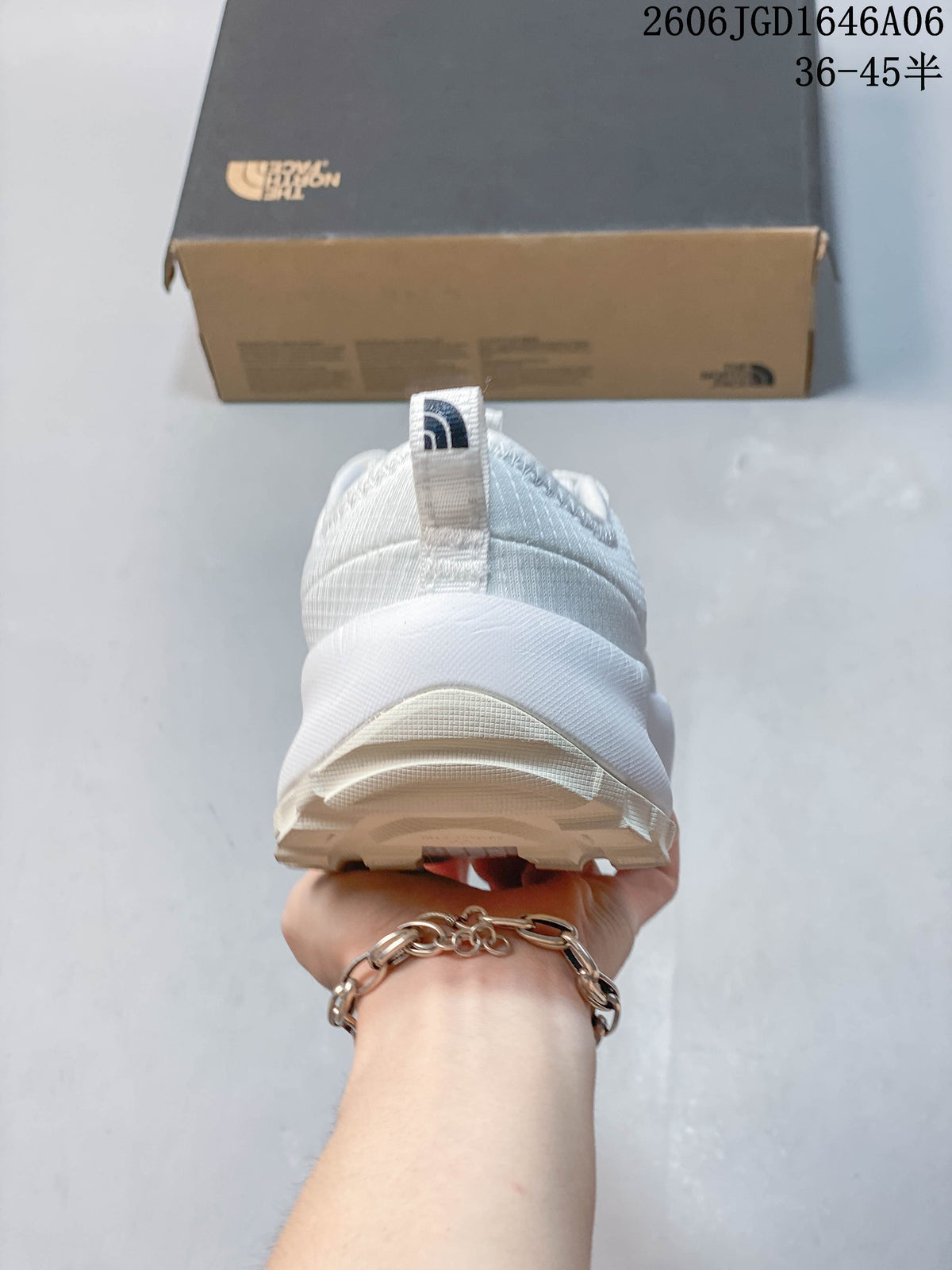 Rear view of the white mule shoe showing the heel pull tab and outsole.