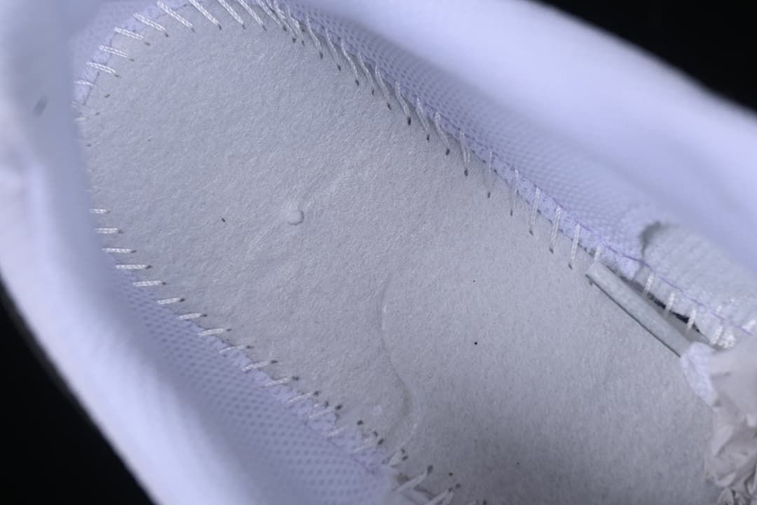 Close-up of stitching and panel construction inside the shoe.