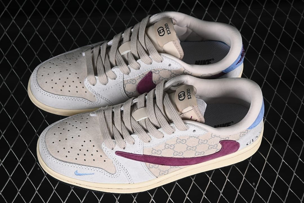 Overhead view of a pair of cream low-top sneakers with burgundy and light blue accents and patterned side panels.