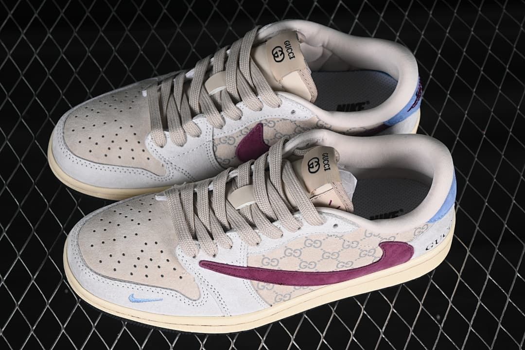Overhead view of a pair of cream low-top sneakers with burgundy and light blue accents and patterned side panels.