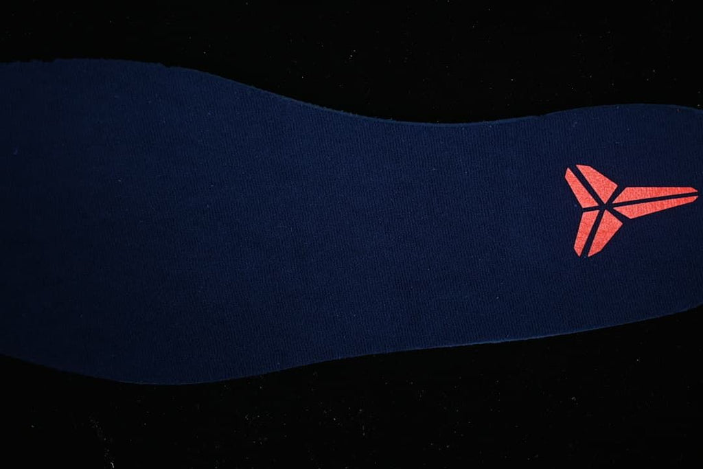 Close-up of the insole with a Kobe logo.