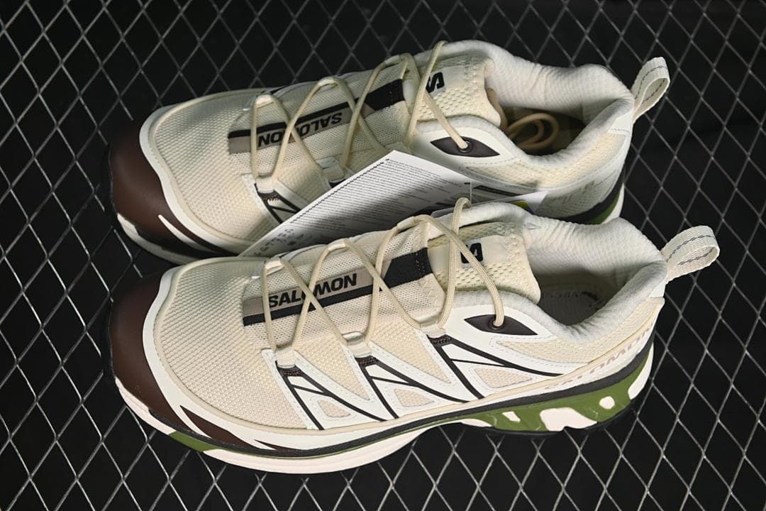 Pair of cream XT-6 Expanse sneakers shown from above and the side.