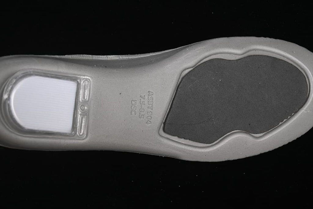 Close-up of the sneaker insole underside with molded markings