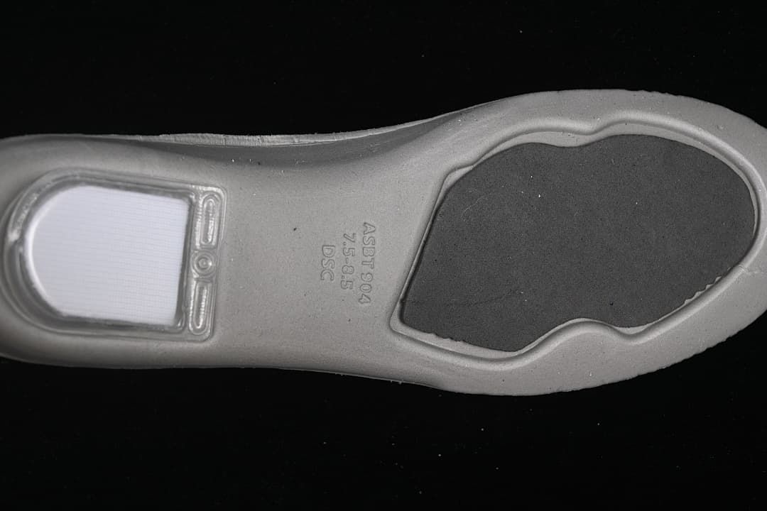 Close-up of the sneaker insole underside with molded markings