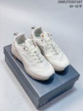 Pair of off-white Kolon Sport low-top sneakers displayed on a shoebox