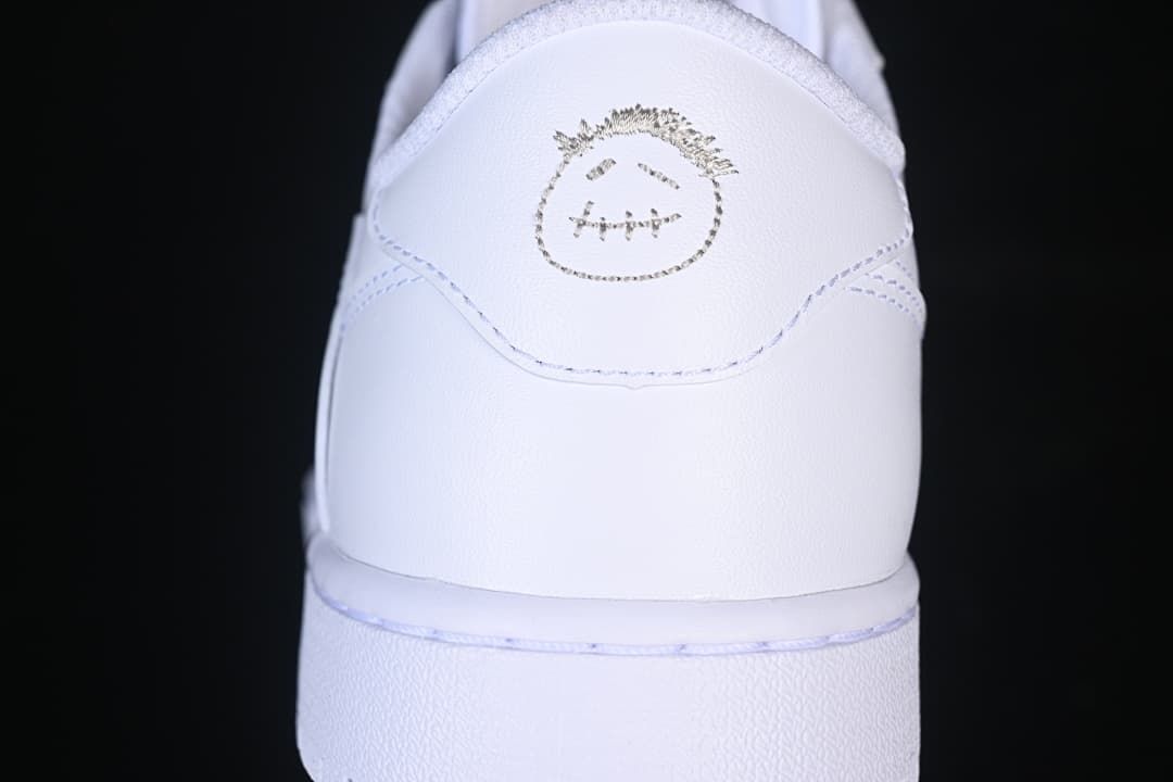 Rear view showing a small graphic on the white heel