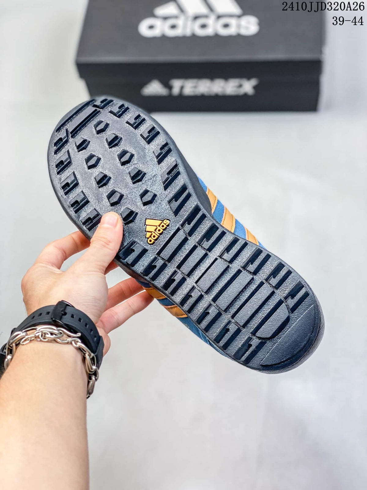 Close-up of the dark patterned outsole on an adidas Daroga Plus shoe