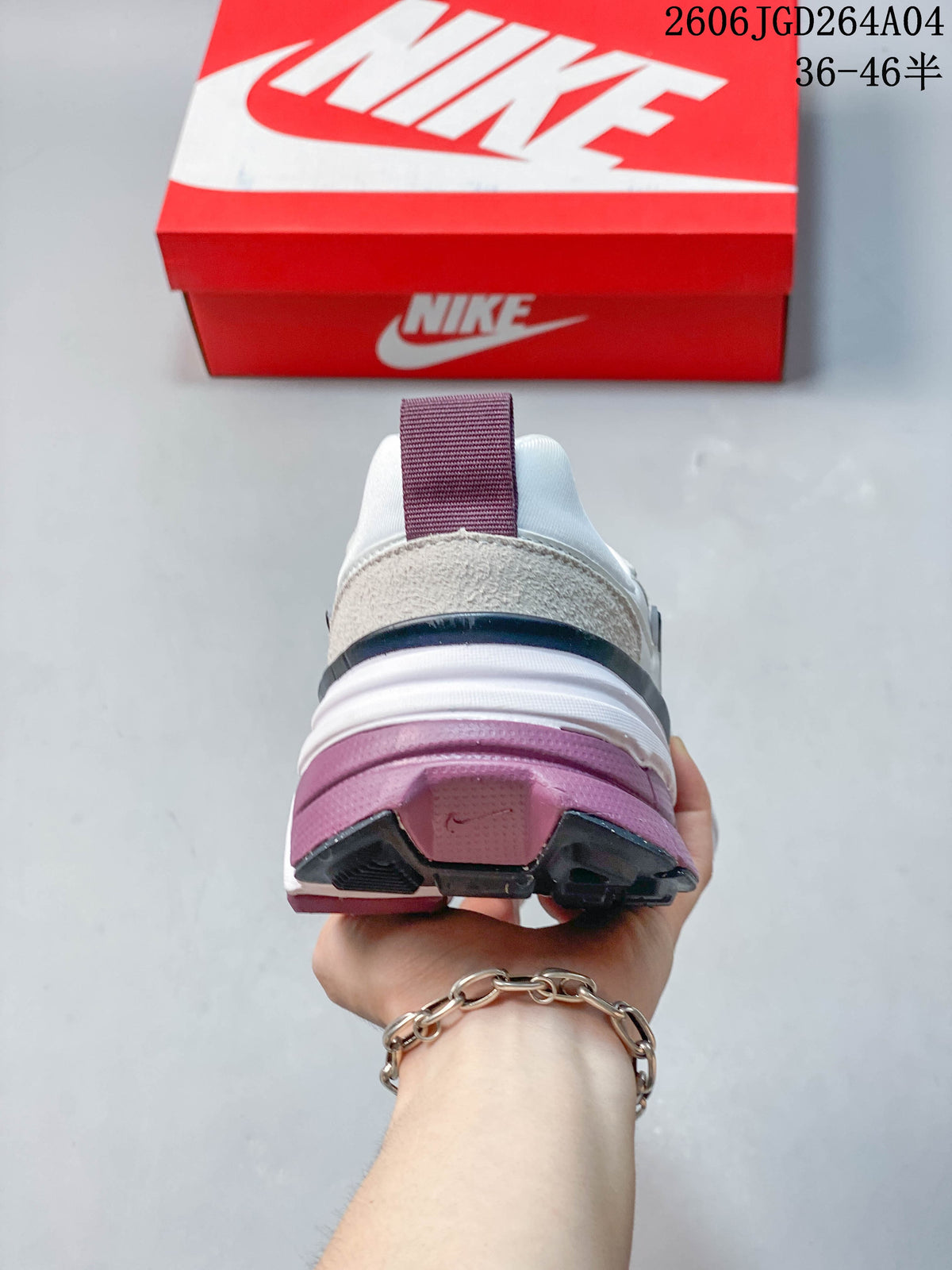 Rear view of the Nike V2K Run showing the heel and plum-accented sole