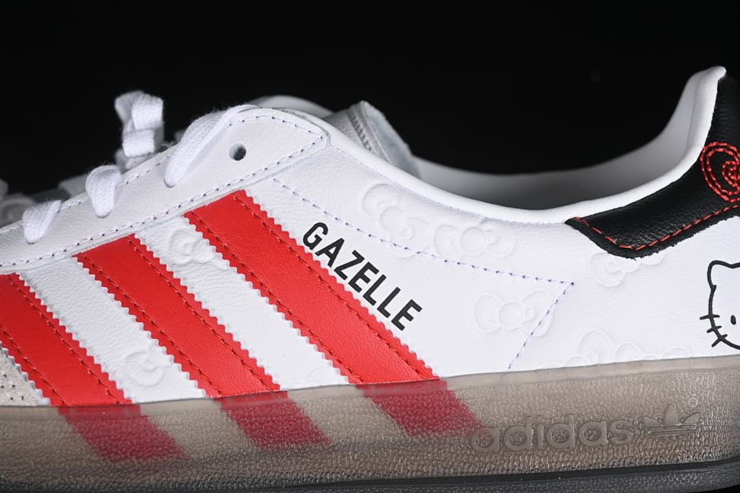 Close-up of the side panel with red stripes, Gazelle lettering, embossed bows, and a grey-toned sole.