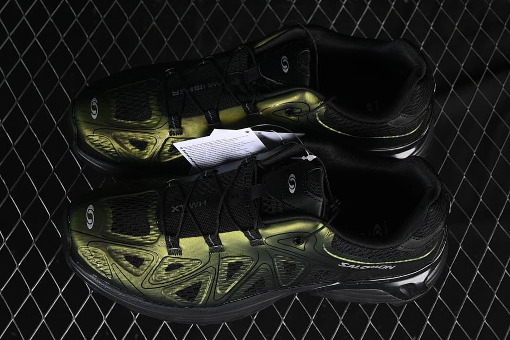 Pair of black and metallic olive Salomon XT-Whisper Void shoes
