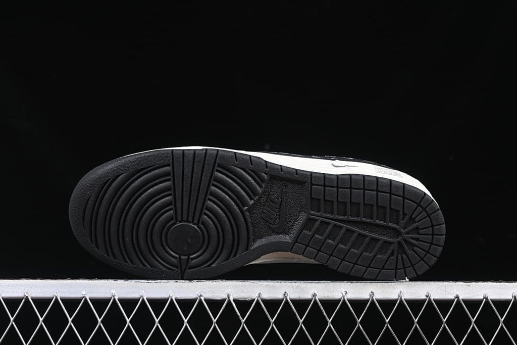 Underside view of the black rubber outsole with circular tread pattern
