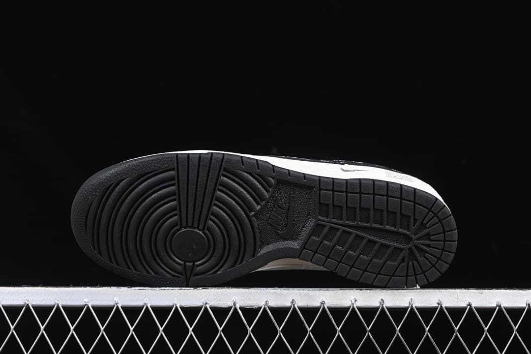 Underside view of the black rubber outsole with circular tread pattern