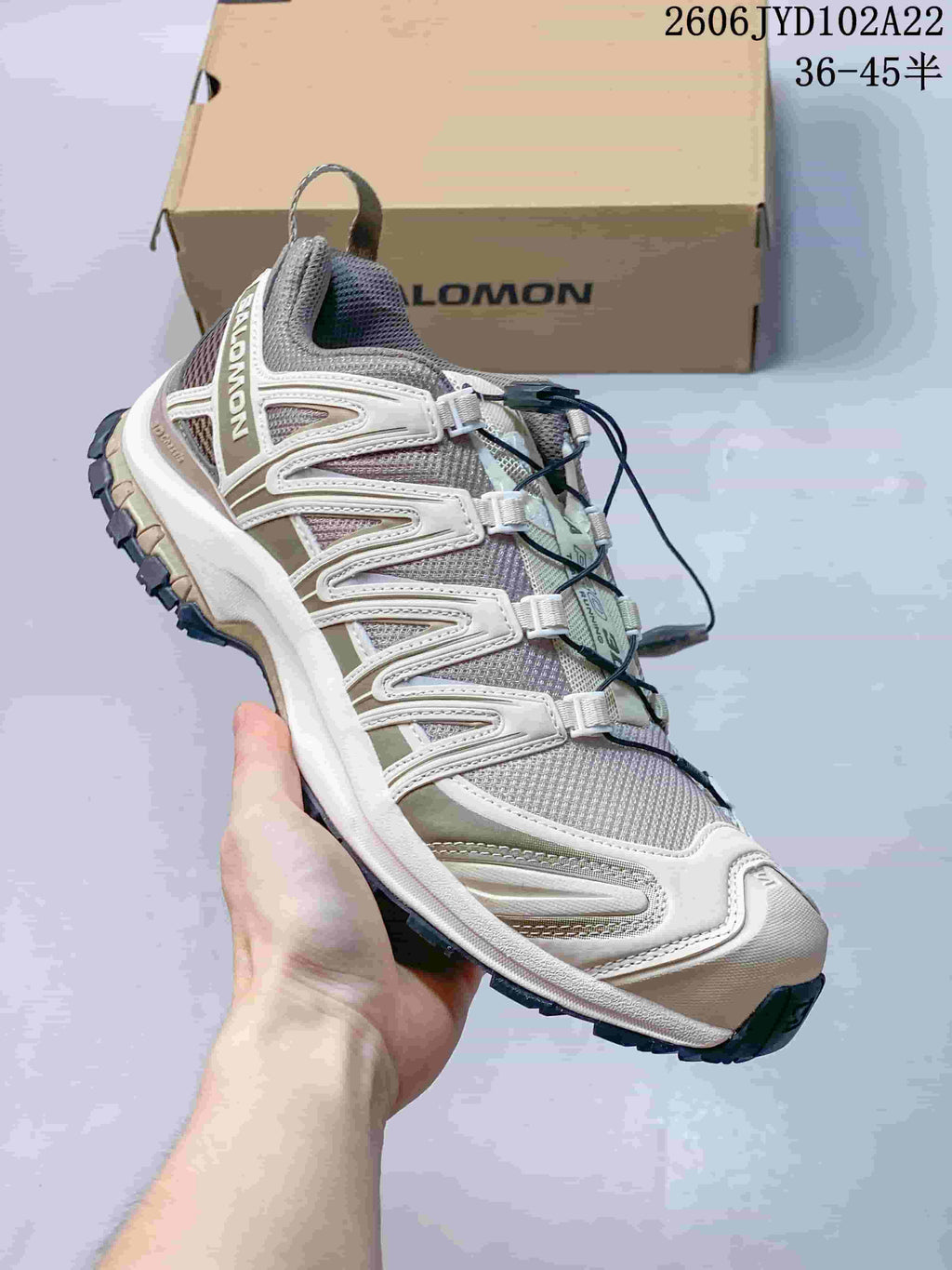 Angled side view of a Salomon XA Pro 3D shoe in cream, grey, and muted olive