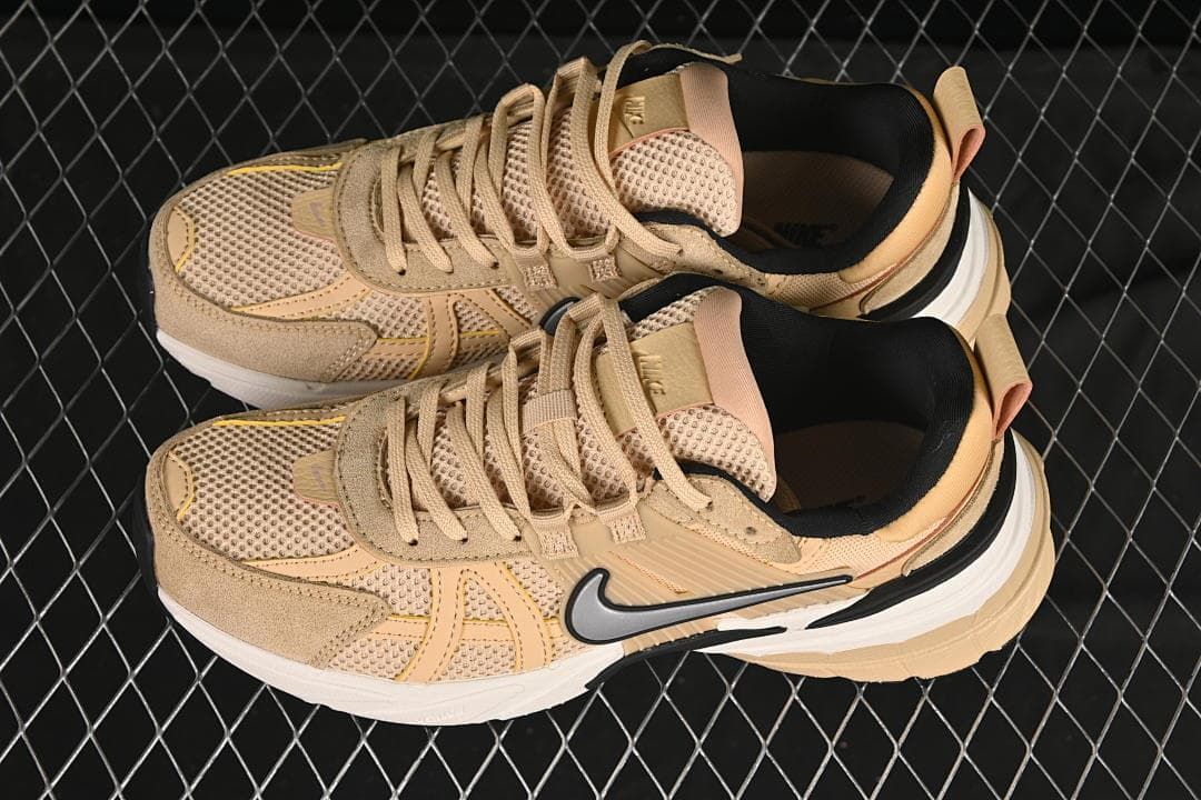 Pair of tan low-top sneakers shown from above at an angle