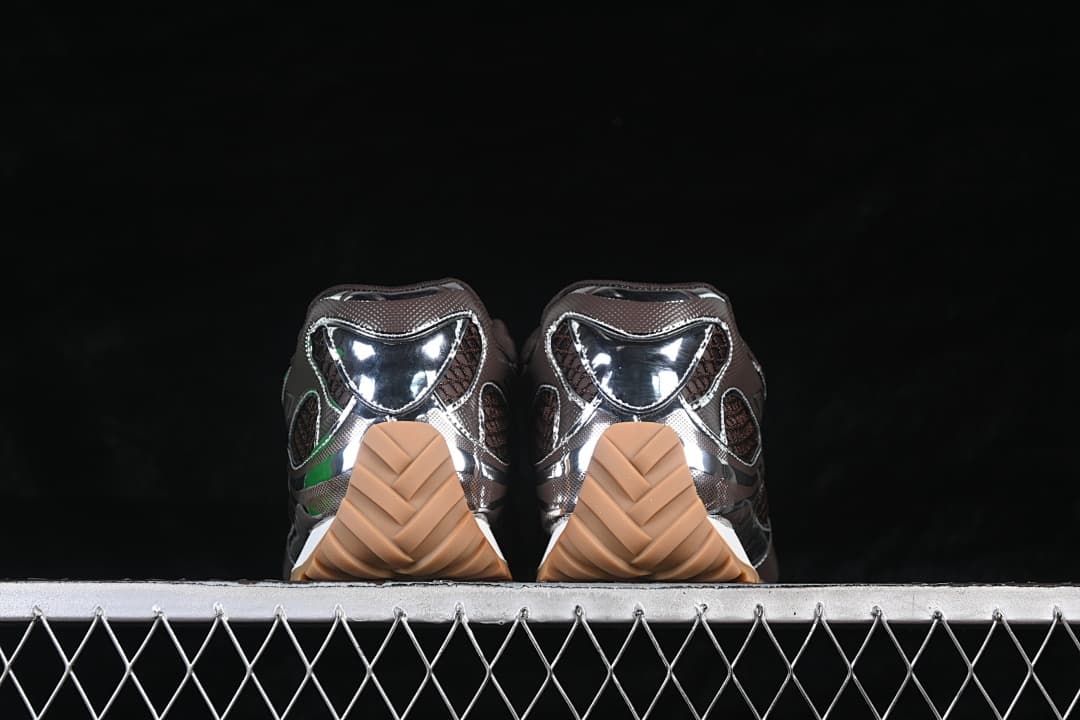 Rear view of the pair showing reflective heel panels and tan outsoles.