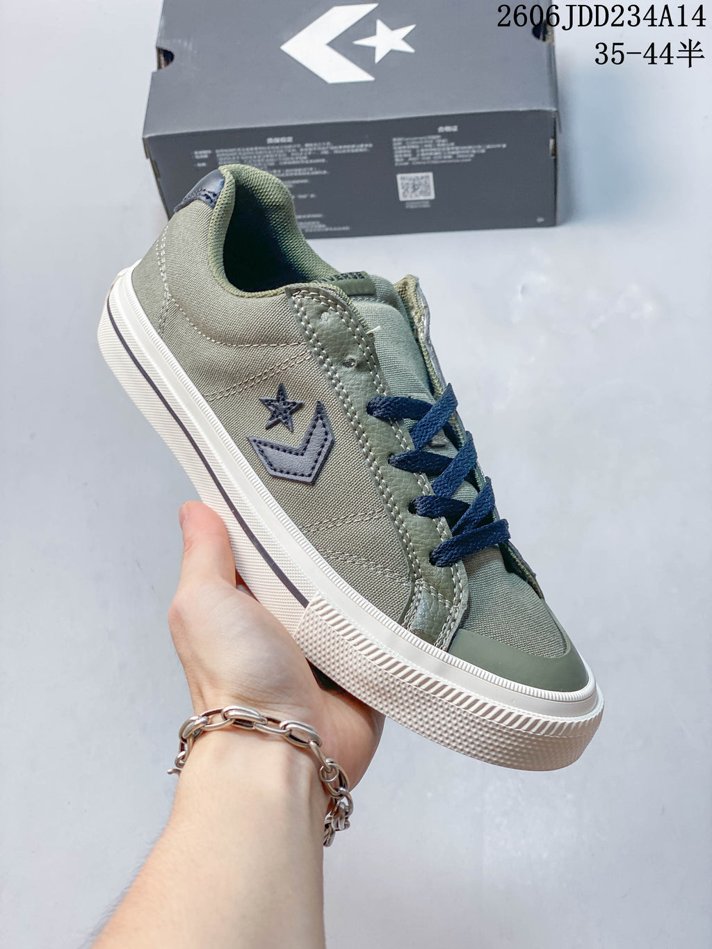 Olive Converse Sport Casual low-top sneaker with navy laces and white sole