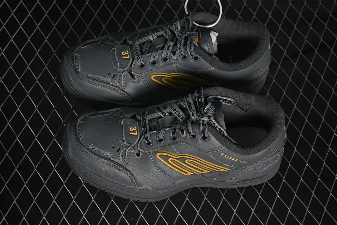 Overhead view of the pair of dark grey sneakers