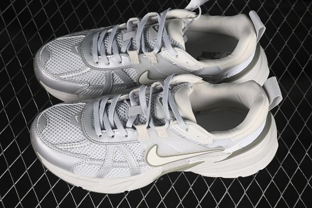 Pair of white and light grey Nike V2K Run sneakers shown from above