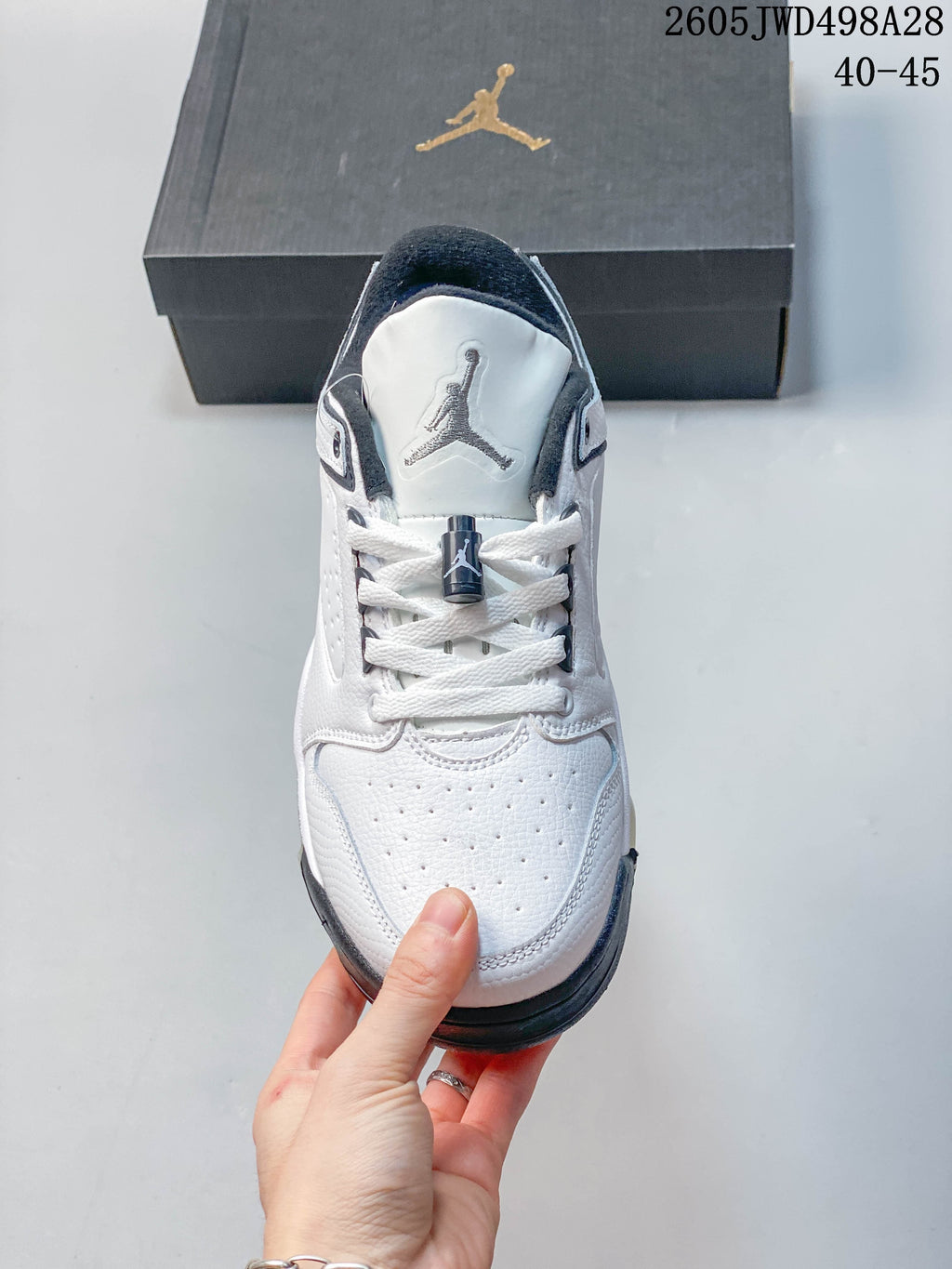 Front view showing the perforated toe, white laces, and Jumpman tongue emblem.