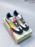 White, yellow and navy adidas Gazelle Indoor sneakers displayed on a horse-patterned box.