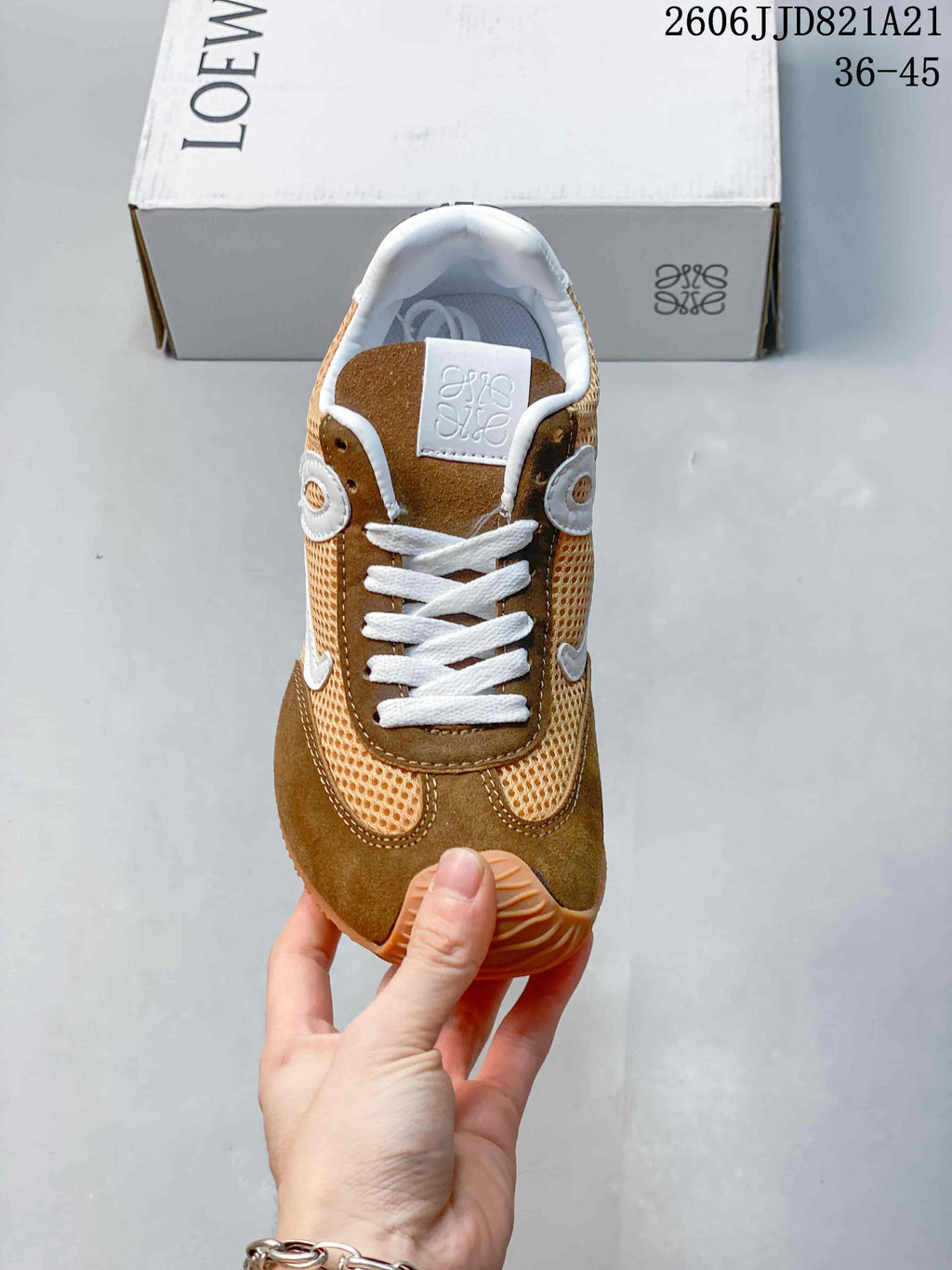 Front view of the brown and tan lace-up sneaker