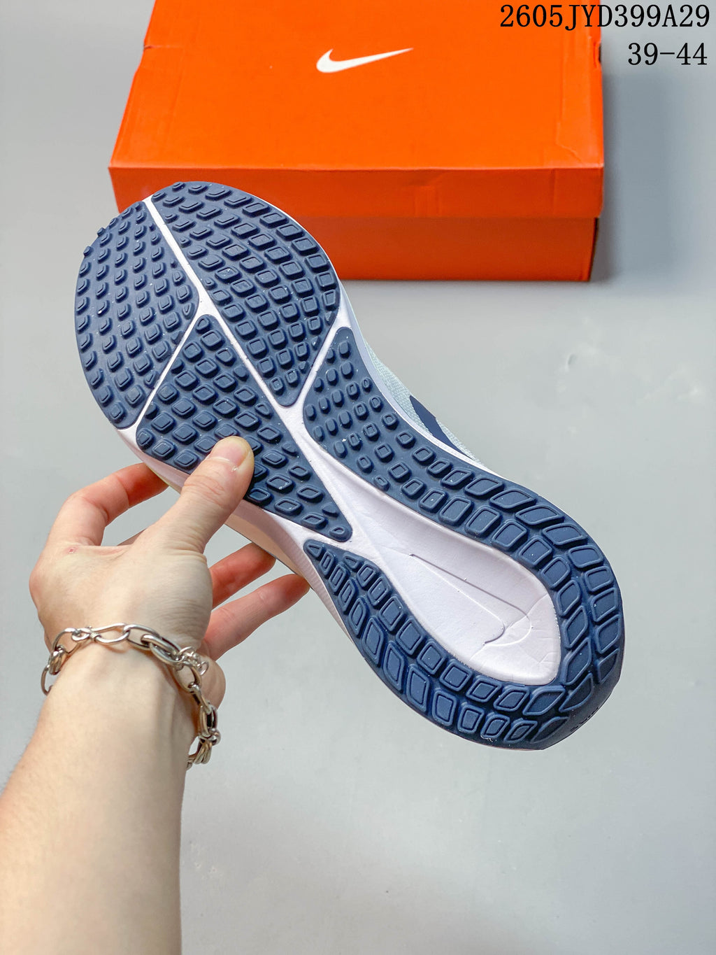Close-up of the dark navy patterned outsole on a Nike Air Zoom Vomero 17 shoe.