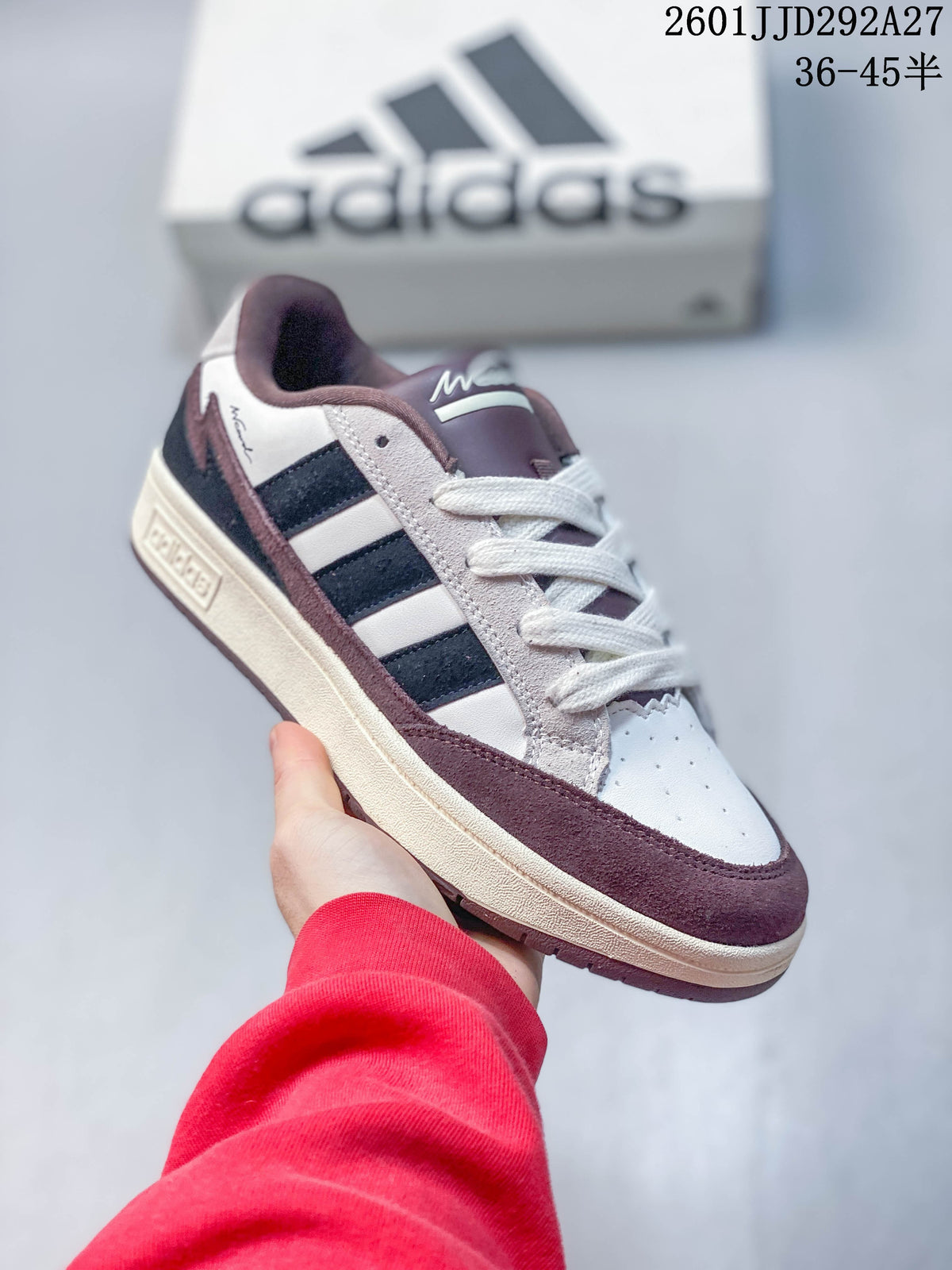 Side view of a white Adidas Wcard Adv sneaker with dark stripes, light-gray panels, and burgundy-colored trim