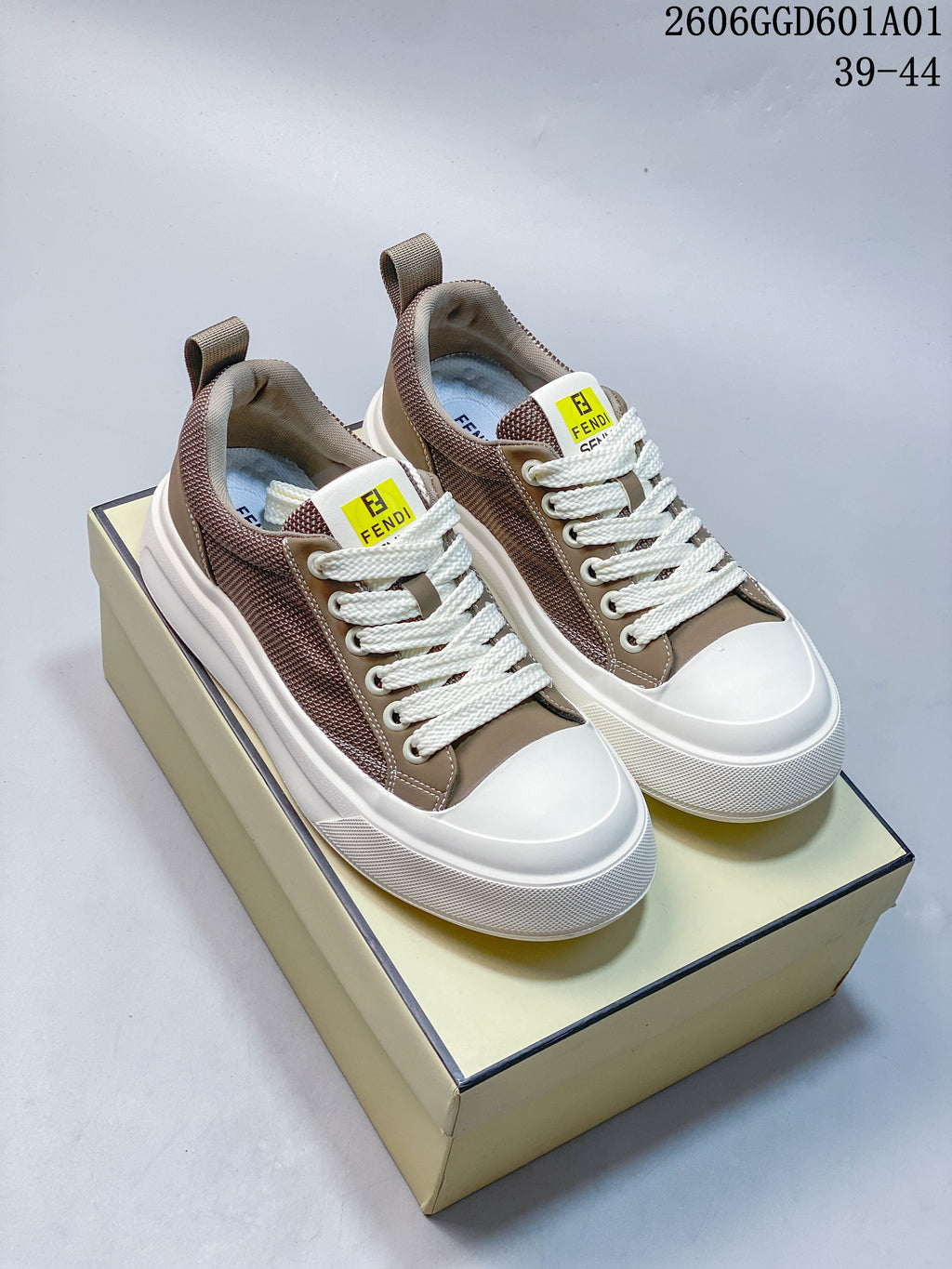 Pair of taupe and brown Fendi Match low-top sneakers with white laces and thick white soles