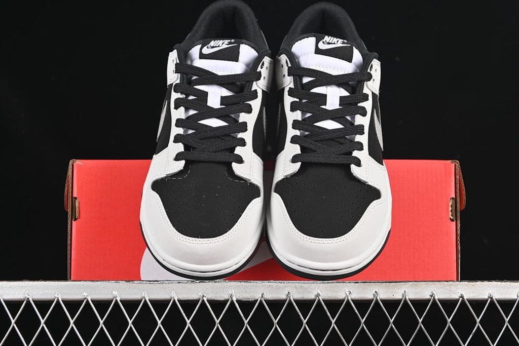 Front view of the pair with black laces and perforated toe boxes