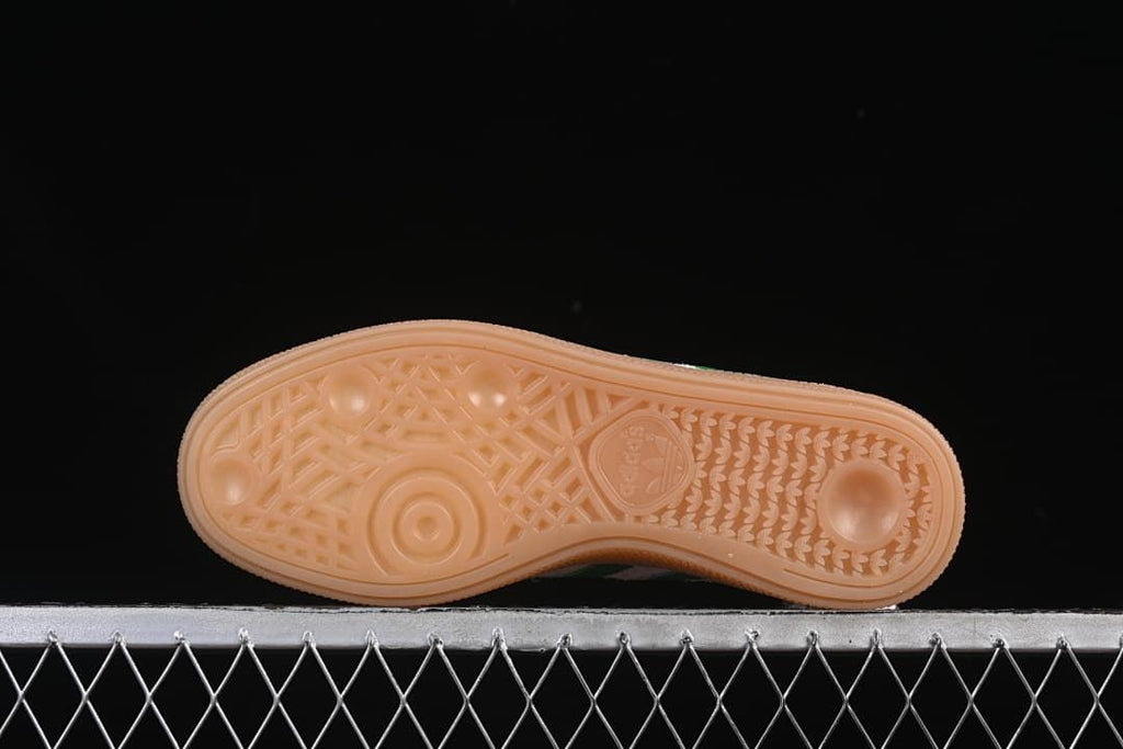Underside view showing the patterned gum-colored outsole