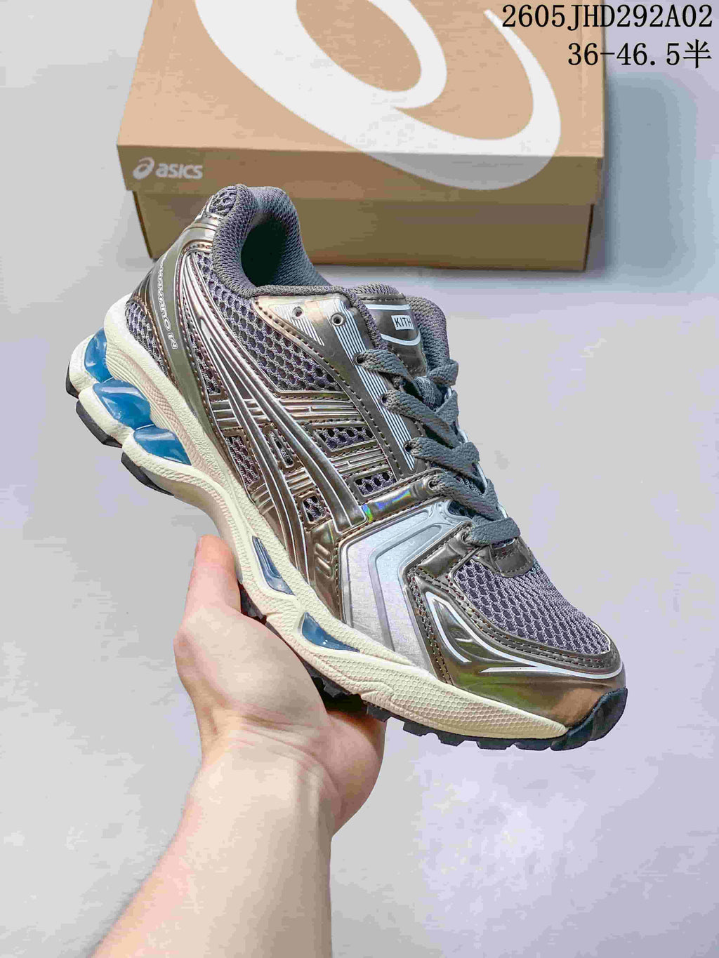 ASICS GEL-KAYANO 14 sneaker in metallic gray with dark mesh and blue accents
