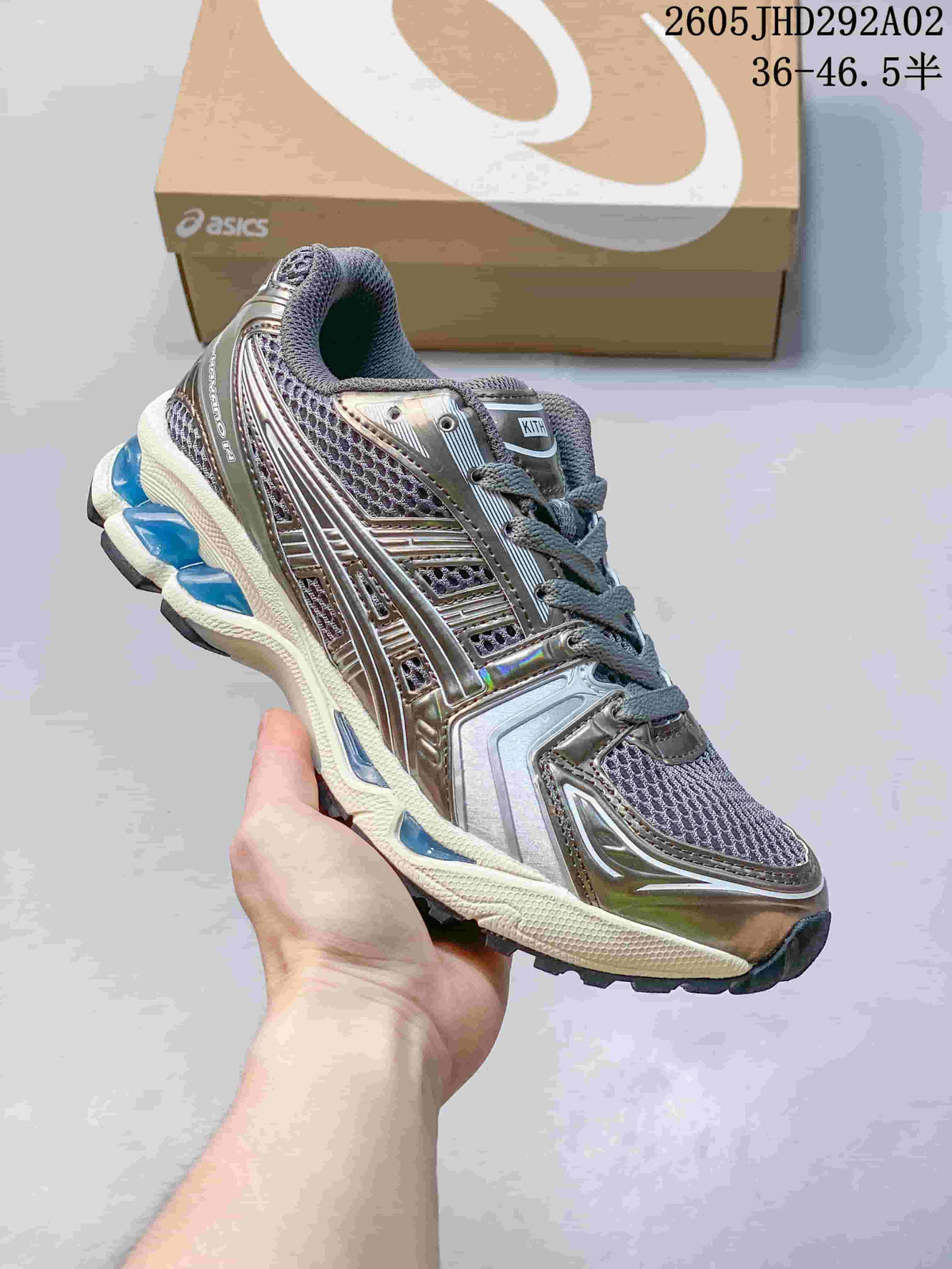 ASICS GEL-KAYANO 14 sneaker in metallic gray with dark mesh and blue accents
