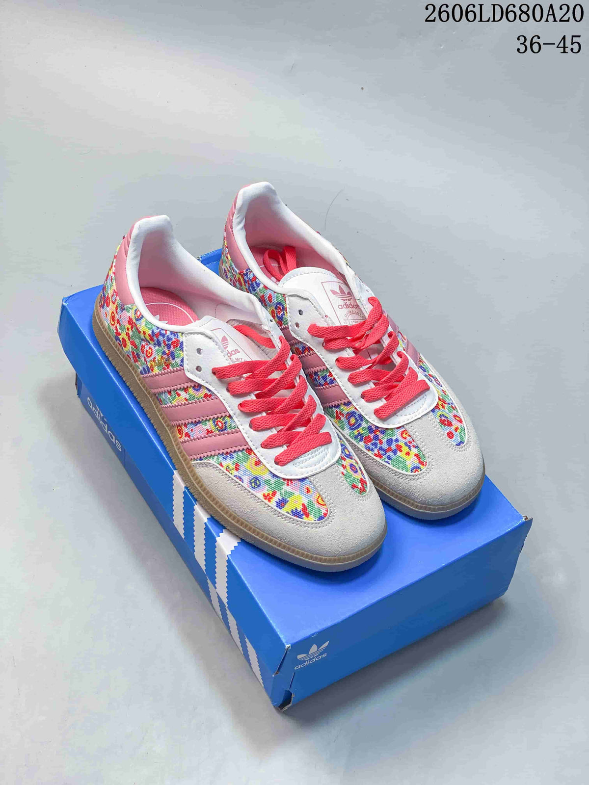 Pair of multicolor floral-patterned Samba OG low-top sneakers with pink stripes and coral laces