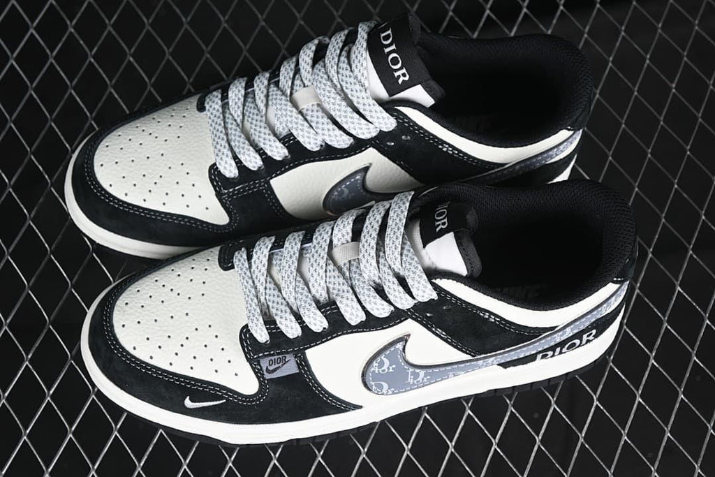 Pair of black, white, and gray low-top sneakers shown from above.