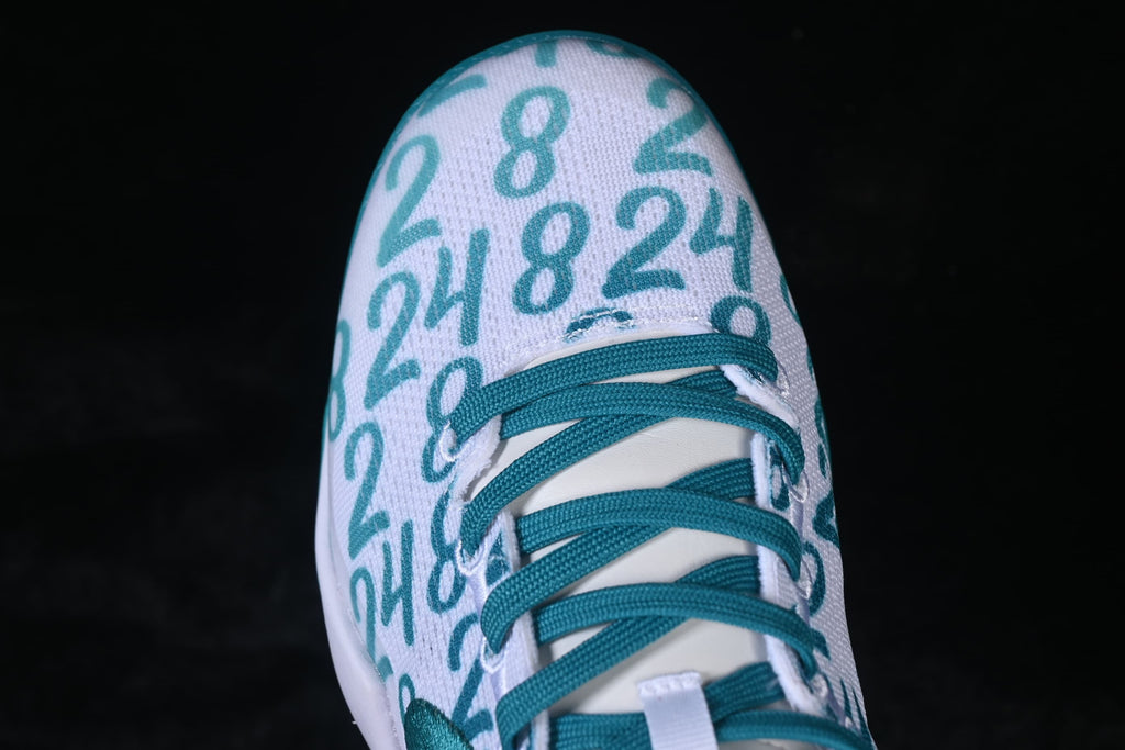 Top-down close-up of the number-patterned toe and teal laces