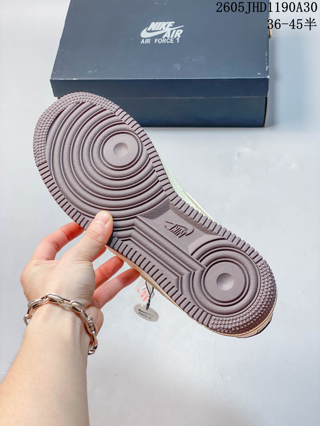 Underside of a Nike Air Force 1 sneaker showing its circular tread pattern