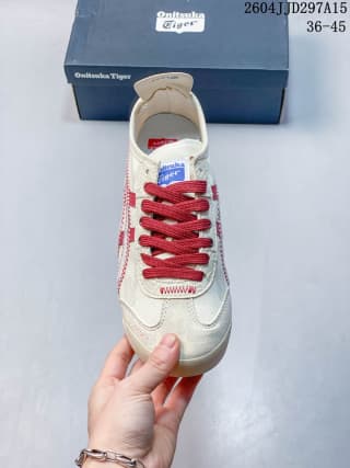 Top view of the sneaker showing the tongue label, red laces, toe panel, and side stripes.